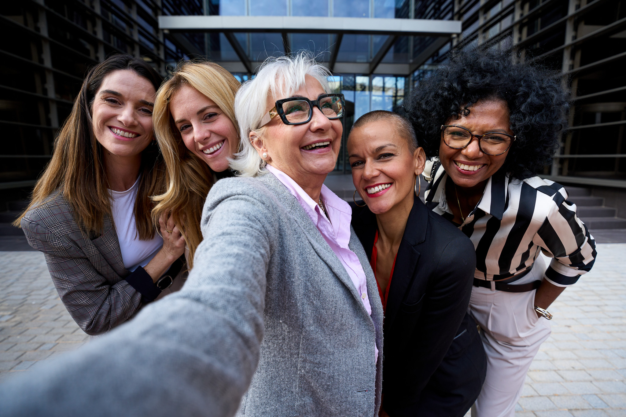 Group of diverse business women taking a selfie.